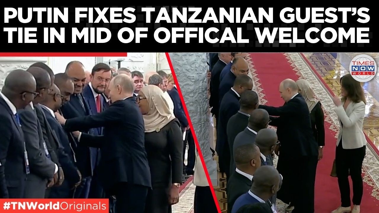 WATCH: Putin Stops Mid-Handshake, Fixes Delegate's Outfit In Front Of Cameras...